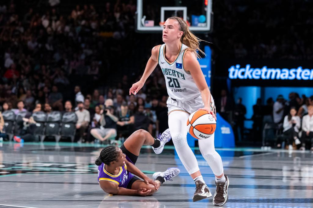 New York Liberty guard Sabrina Ionescu (20) drives down court in the first half against the Los Angeles Sparks