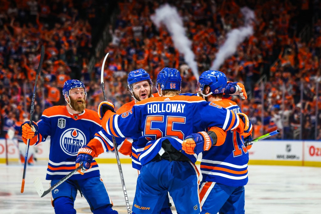 Edmonton Oilers center Adam Henrique (19) celebrates his goal with teammates against the Florida Panthers during the second period in game six of the 2024 Stanley Cup Final at Rogers Place. 