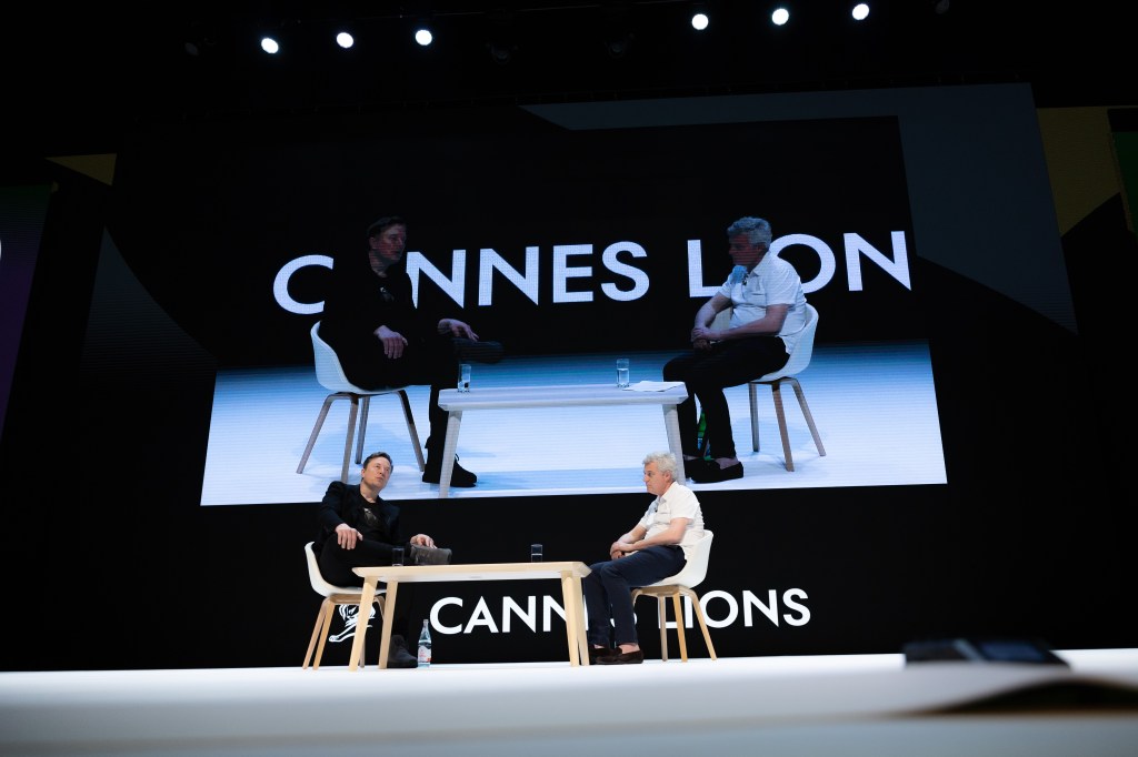 Musk made an appearance on Wednesday at Cannes Lions. He is seen left being interviewed by WPP CEO Mark Read.