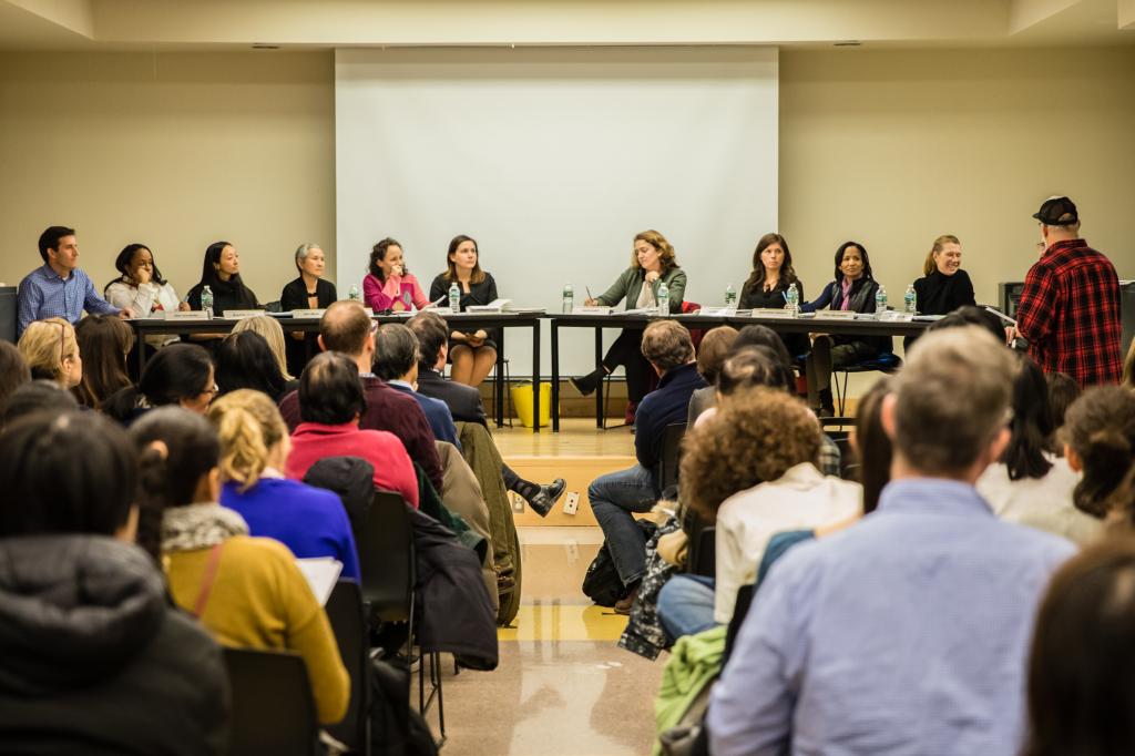 A group of people including Eric Goldbreg, Joanne Diaz, Amy Cheung, Shino Tanikawa, Robin Broshi, Bonnie Laboy, Maud Maron, Lauren Chung, Josephine Ishmon and Emily Hellstrom sitting and listening at a Community Education Council District 2 meeting in Chelsea, Manhattan.