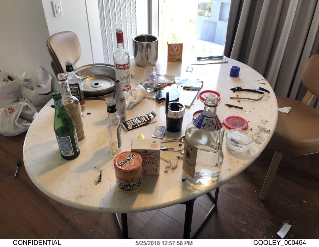 Photo of a table with drug paraphernalia and alcohol bottles, used as an exhibit in Hunter Biden's gun trial