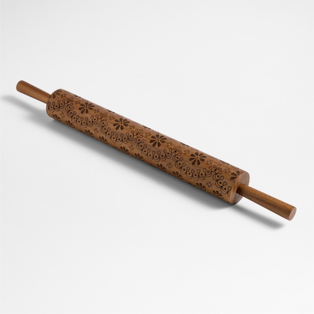 A wooden eyelet rolling pin designed by Laura Kim for Crate and Barrel