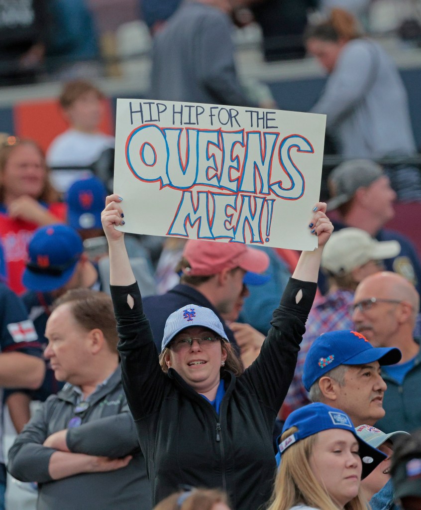 New York Mets at London Stadium: A fan holds up a sign for the Mets after the final out of the 9th inning. 
