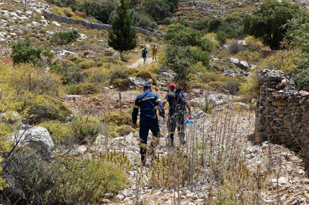 Fire Department personnel inspect an area, following the search for missing British TV doctor Michael Mosley