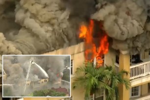 Firefighters battling a 3-alarm fire at Temple Court Apartments in downtown Miami