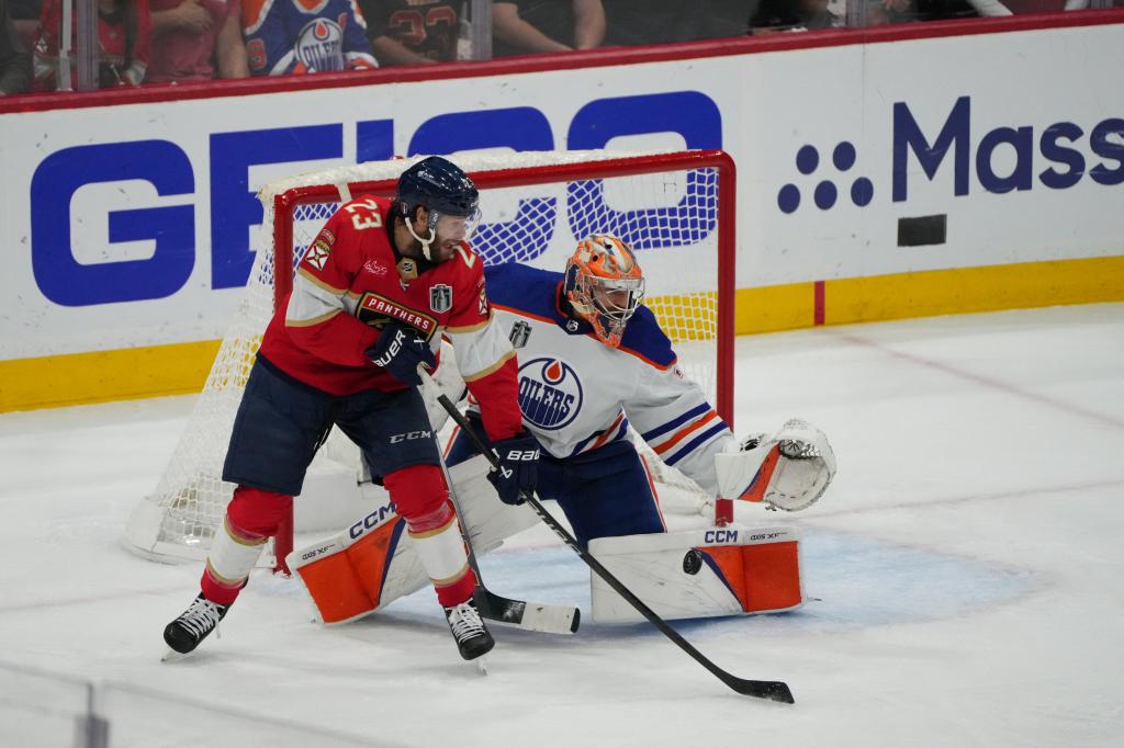 Florida Panthers forward Carter Verhaeghe (23) tips in the puck to score against Edmonton Oilers goaltender Skinner Stuart (74) during the first period in game seven of the 2024 Stanley Cup Final.