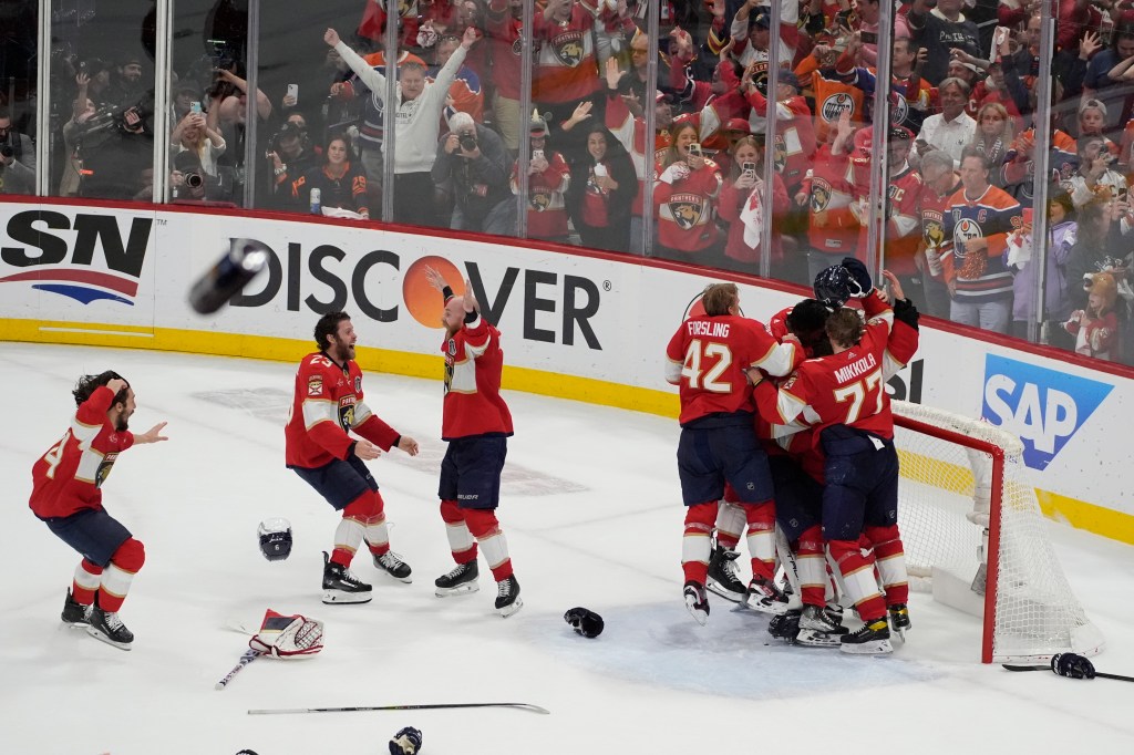 Florida Panthers players celebrate after defeating the Edmonton Oilers in Game 7 of the NHL hockey Stanley Cup Final.