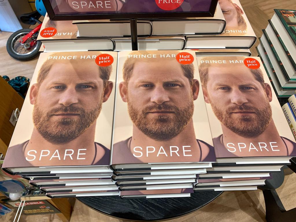 Half price copies of Prince Harry's book 'Spare' displayed on a table in a book shop in Windsor, Berkshire