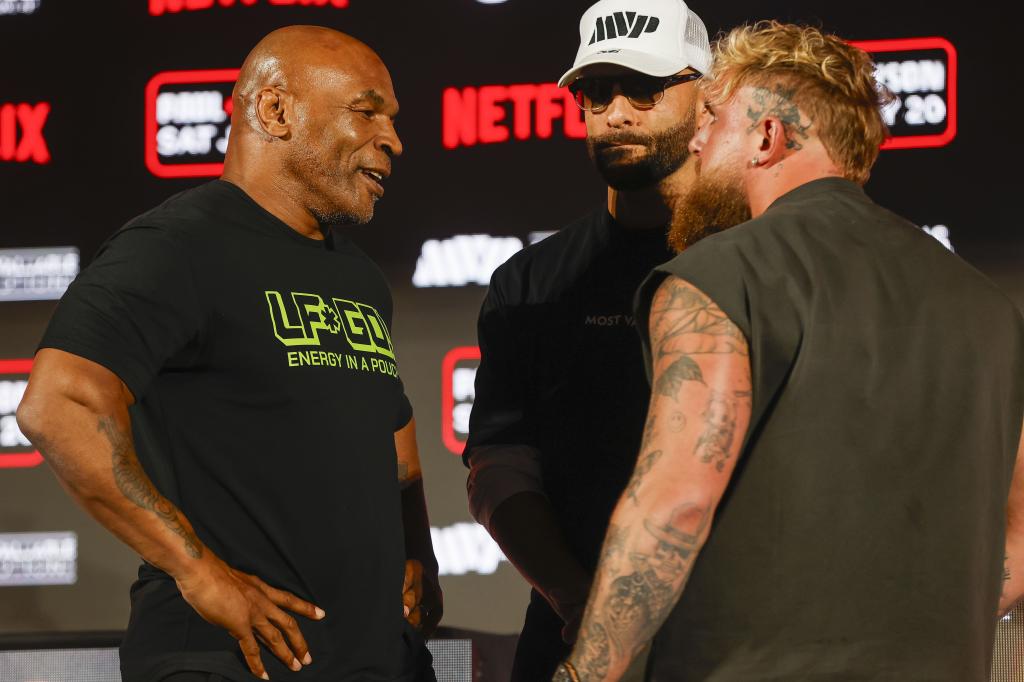 Jake Paul and Mike Tyson facing off at a pre-fight press conference in Arlington, Texas on 16 May 2024