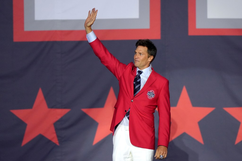 Former New England Patriots quarterback Tom Brady waves to the crowd at the conclusion of the Patriots Hall of Fame induction ceremonies for Brady at Gillette Stadium, Wednesday, June 12, 2024, in Foxborough, Mass.