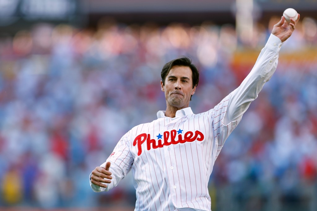 Former Philadelphia Phillies pitcher Cole Hamels throws out the first pitch after a ceremony where he officially retired with the Phillies before a baseball game against the Arizona Diamondbacks at Citizens Bank Park on June 21, 2024.
