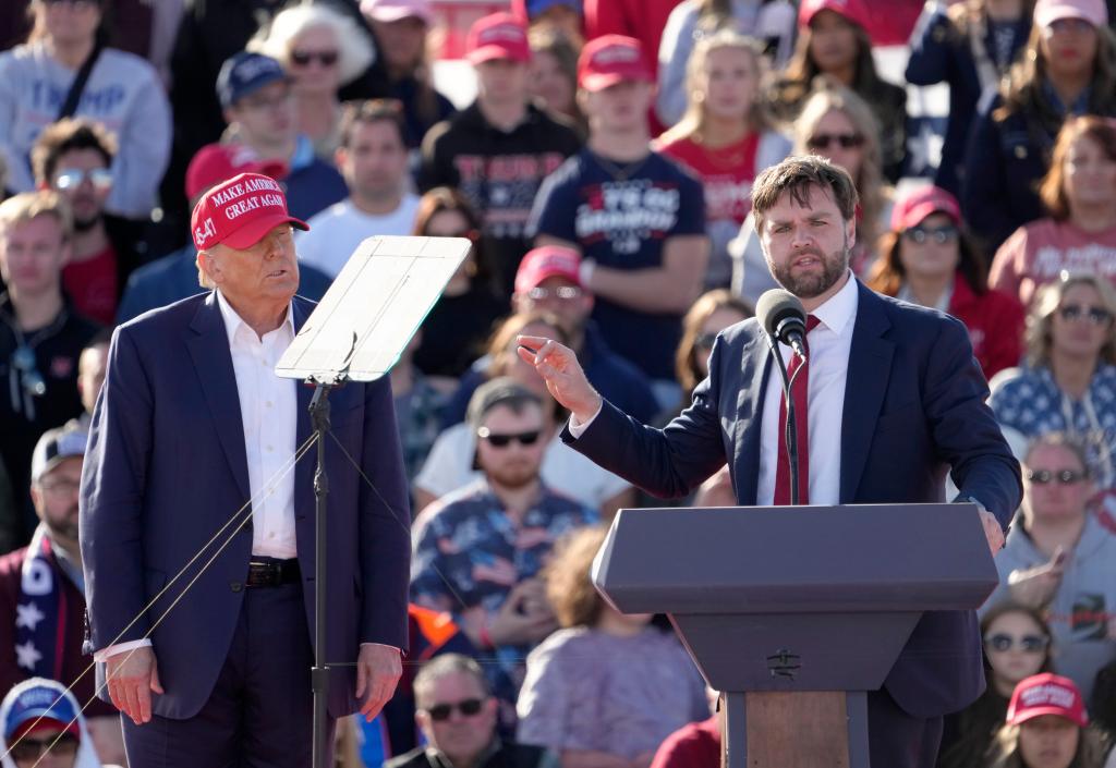 Donald Trump appears with U.S. Senator JD Vance outside Wright Bros. Aero Inc at the Dayton International Airport on March 16, 2024 in Dayton, Ohio.