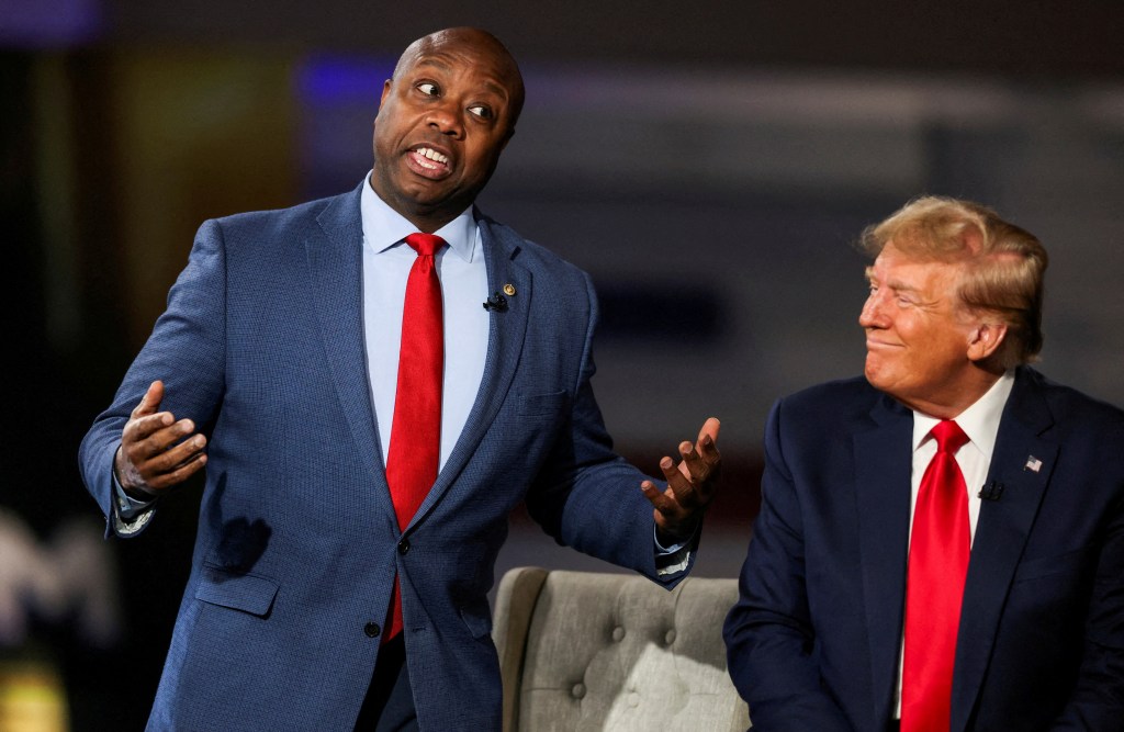 Senator Tim Scott (R-SC) and former U.S. President and Republican presidential candidate Donald Trump participate in a Fox News town hall with Laura Ingraham in Greenville, South Carolina, U.S. February 20, 2024.