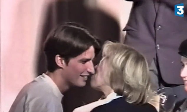 A young Emmanuel Macron kissing his older teacher, Brigitte Trogneux, in 1993