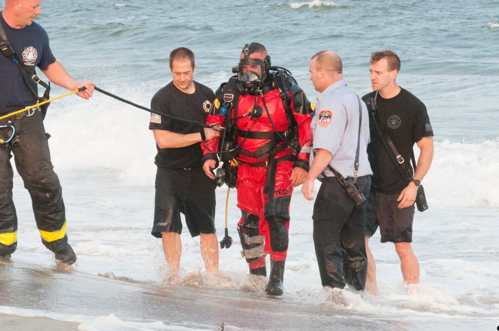 The diver comes out of the water.