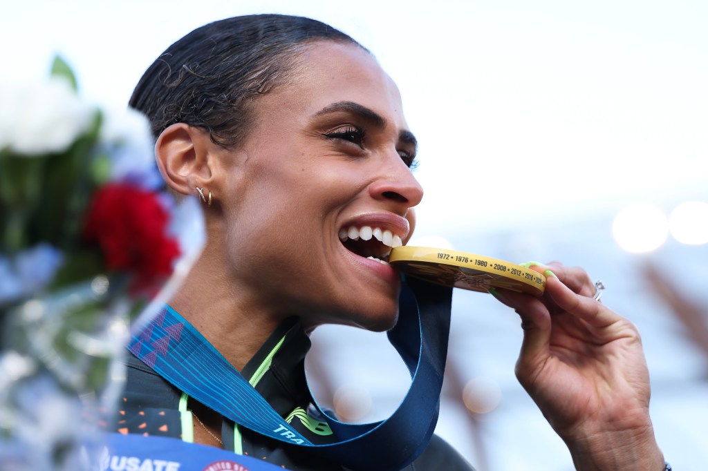 Sydney McLaughlin-Levrone poses with the gold medal after setting a new world record in the women's 400 meter hurdles final on Day Ten of the 2024 U.S. Olympic Team Track & Field Trials at Hayward Field on June 30, 2024 in 