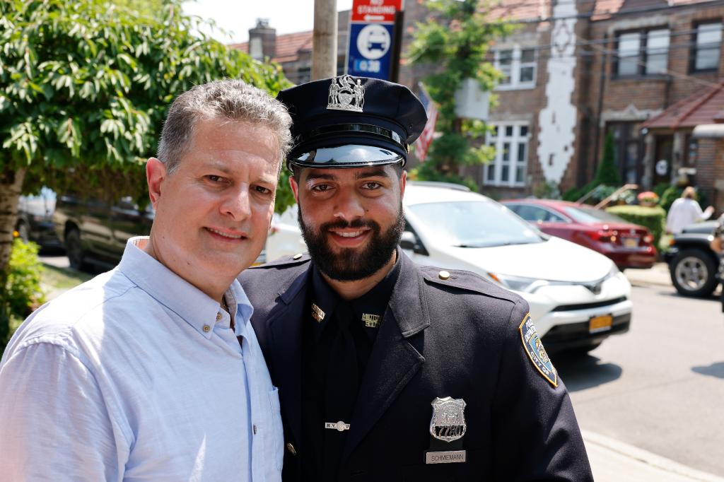 Father and son at street renaming ceremony for cop killed 50 years ago..