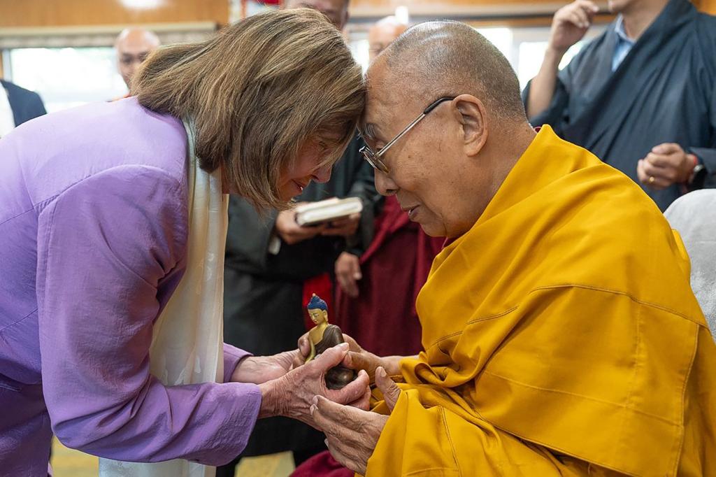 This handout photograph taken and released on June 19, 2024 by the Official website of Dalai Lama shows Former House speaker Nancy Pelosi (L) greets Tibetan spiritual leader Dalai Lama during a meeting with a group of senior US lawmakers at his residence in Dharamsala.