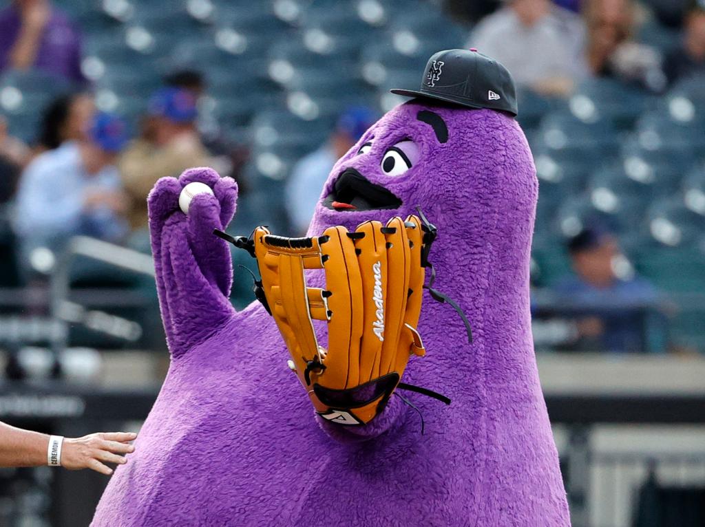 Grimace throwing the first pitch at a Mets vs Miami Marlins baseball game at Citi Field in Queens, New York, USA on June 12, 2024