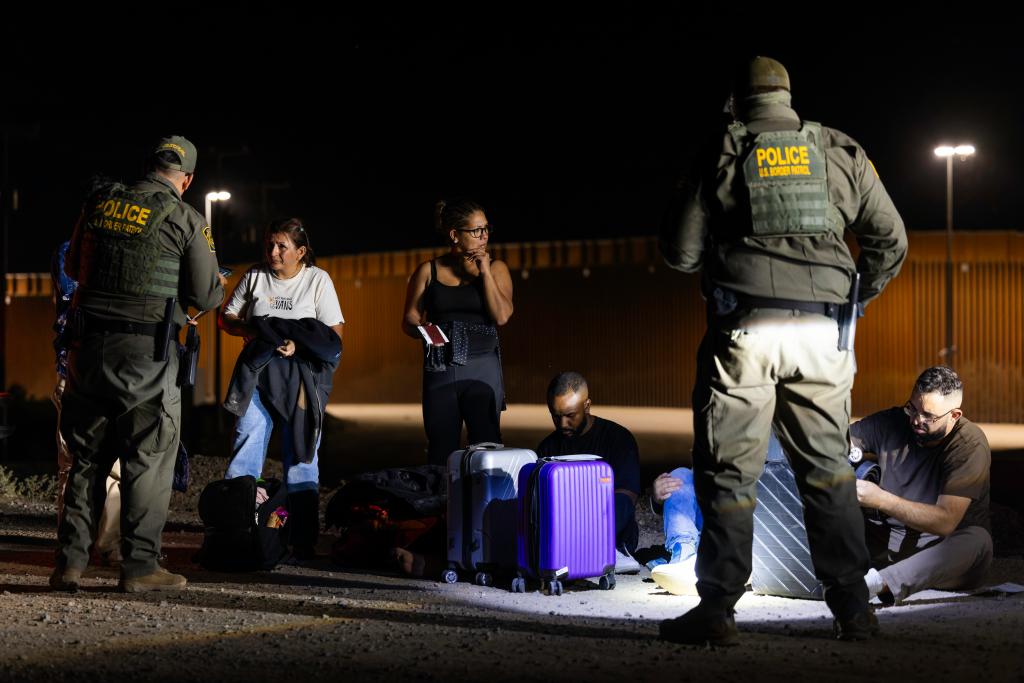 Migrants turn themselves into Border Patrol agents in Yuma, Arizona.