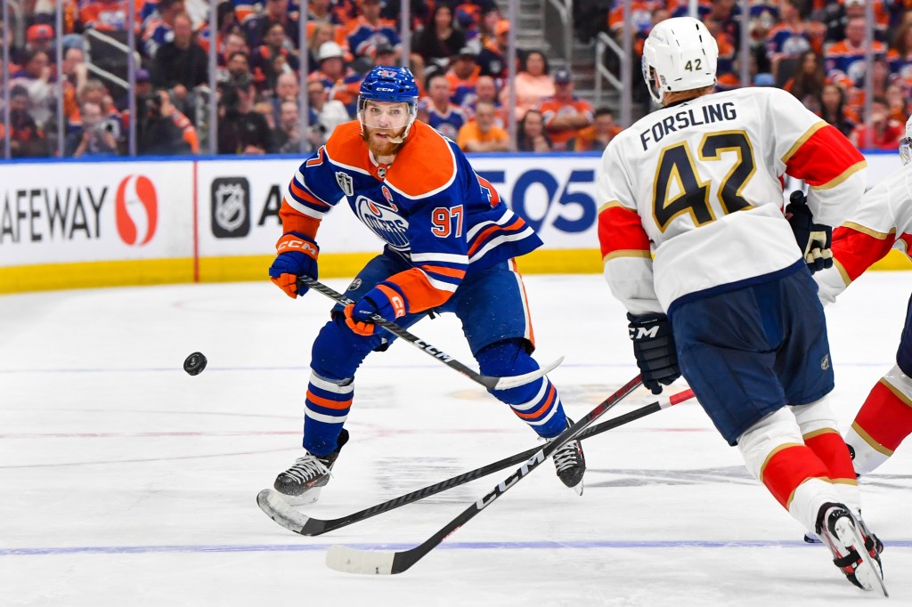 Gustav Forsling #42 of the Florida Panthers skates against Connor McDavid #97 of the Edmonton Oilers in Game Six of the 2024 Stanley Cup.