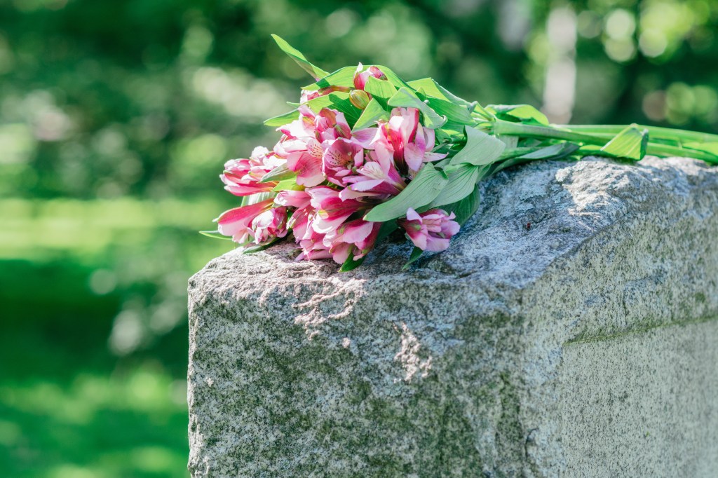 tombstone with flowers