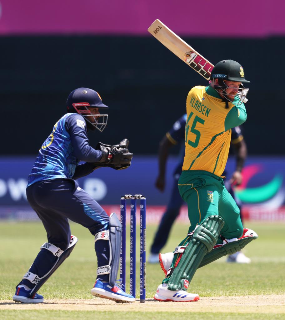 Heinrich Klaasen of South Africa in green uniform playing a shot at the ICC Men's T20 Cricket World Cup in Nassau County International Cricket Stadium