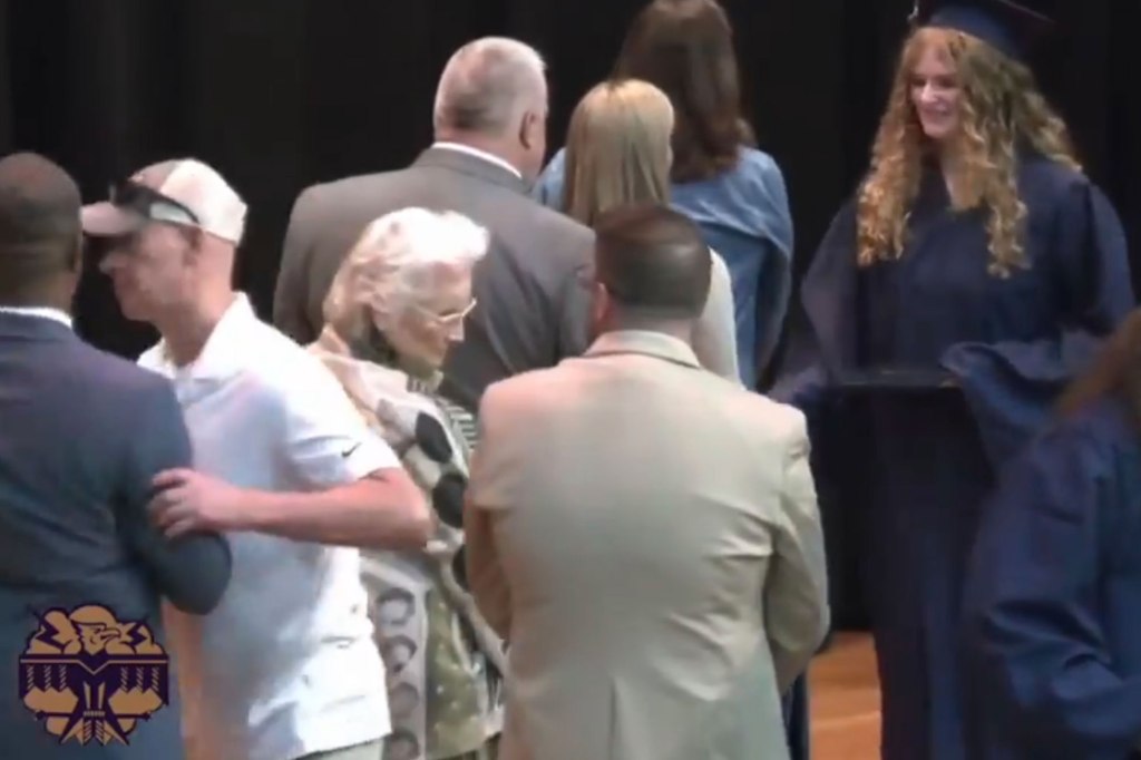 Eddy shoved Briggs aside as his daughter was walked the graduation stage to collect her diploma in late May