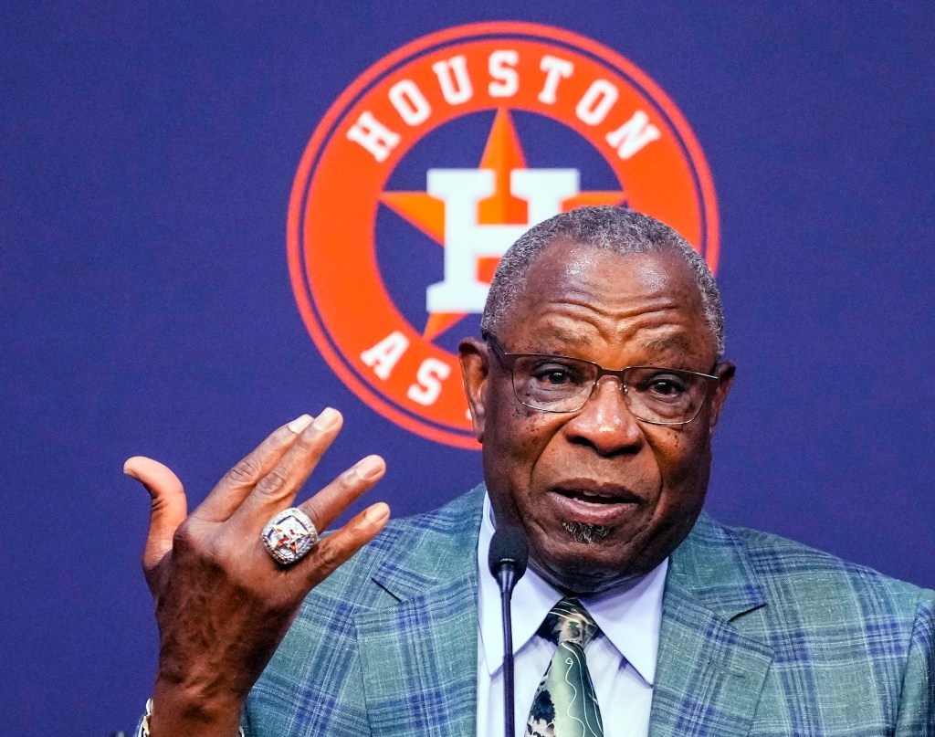 Dusty Baker holds up his Astros World Series ring as he announces his retirement on Oct. 26, 2023.