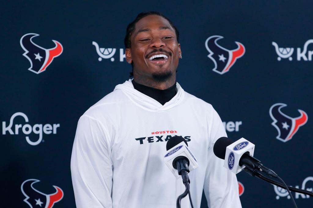 Houston Texans wide receiver Stefon Diggs answering questions at a press conference during the team's minicamp, June 4, 2024, in Houston