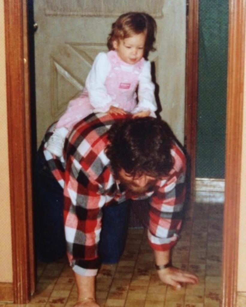 A childhood photo of Samantha McAfee with her dad.