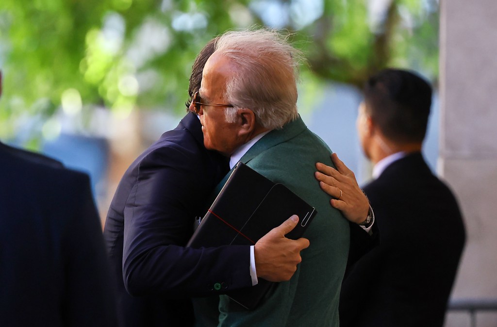 Hunter Biden embracing his uncle, Jim Biden, outside the J. Caleb Boggs Federal Building in Wilmington, Delaware during his trial