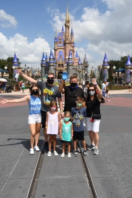 family outside Disney castle