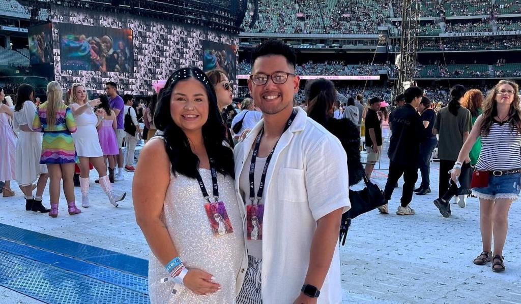 Jenn Gutierrez and Michael Sin smiling at the Taylor Swift concert in Melbourne, with Jenn being pregnant and experiencing contractions