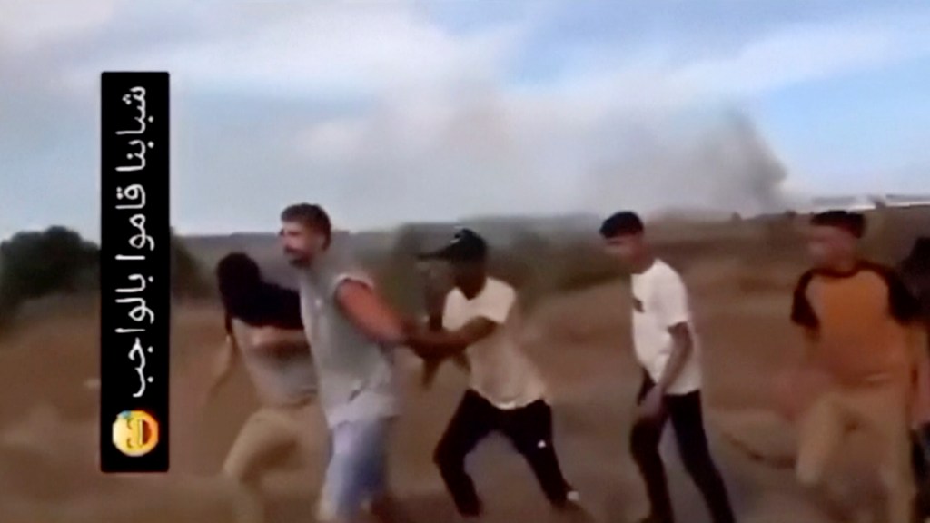 Argamani's boyfriend, Avinatan Or (second from the left), was also seen in the kidnapping video yelling for her as the terrorists abducted them. 