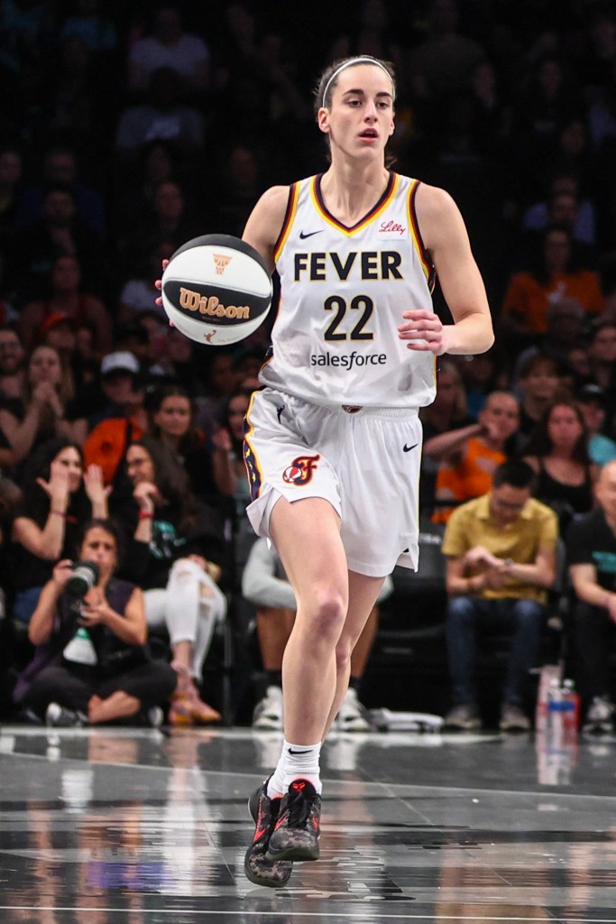 Indiana Fever guard Caitlin Clark (22) brings the ball up court in the first quarter against the New York Liberty at Barclays Center.