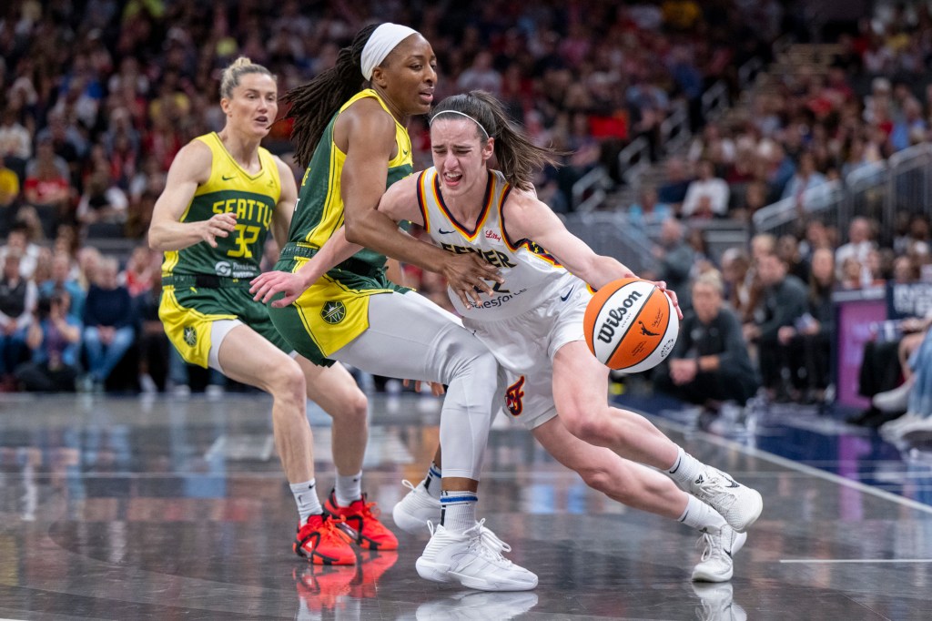 Caitlin Clark, right, drives against Seattle Storm forward Nneka Ogwumike during the first half on May 30, 2024.