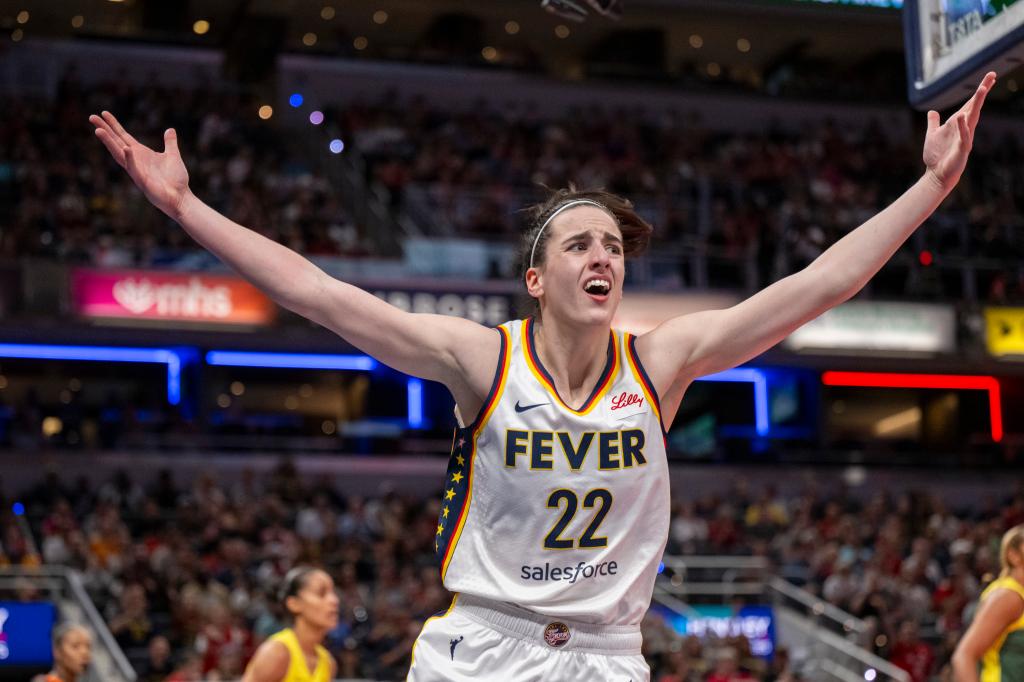 Caitlin Clark reacts after scoring against the Seattle Storm.