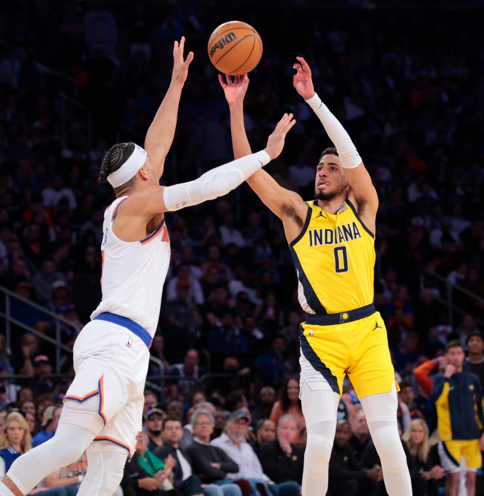Tyrese Haliburton #0 puts up a shot as New York Knicks guard Josh Hart #3 rushes to defend during the fourth quarter.