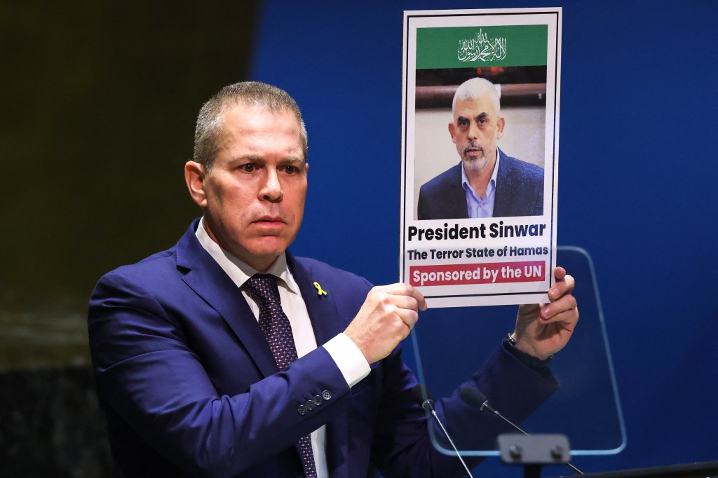 Israeli Ambassador to the United Nations Gilad Erdan holds a poster of wanted Hamas chief Yahya Sinwar. 