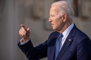 President Joe Biden arrives for a family photo after the meeting of the G7 and outreach guests at the G7 summit.