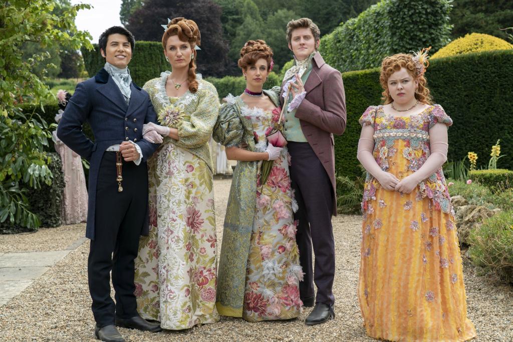 Bridgerton cast members James Phoon, Bessie Carter, Harriet Cains, Lorn Macdonald, and Nicola Coughlan in formal attire from Season 3, episode 301 'Out of the Shadows'