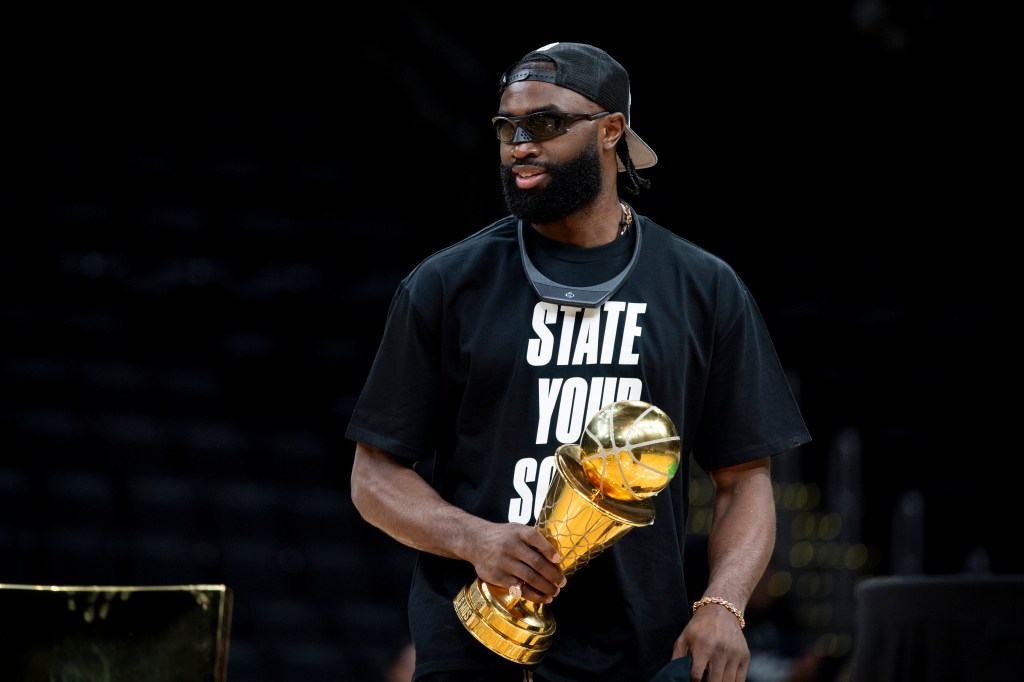 Jaylen Brown #7 of the Boston Celtics is introduced holding the MVP trophy during the Boston Celtics Victory Event following their 2024 NBA Finals win at TD Garden on June 21, 2024 in Boston, Massachusetts.