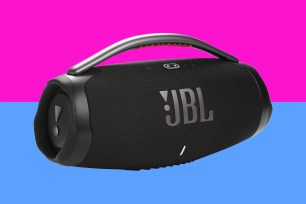A black JBL speaker with a handle