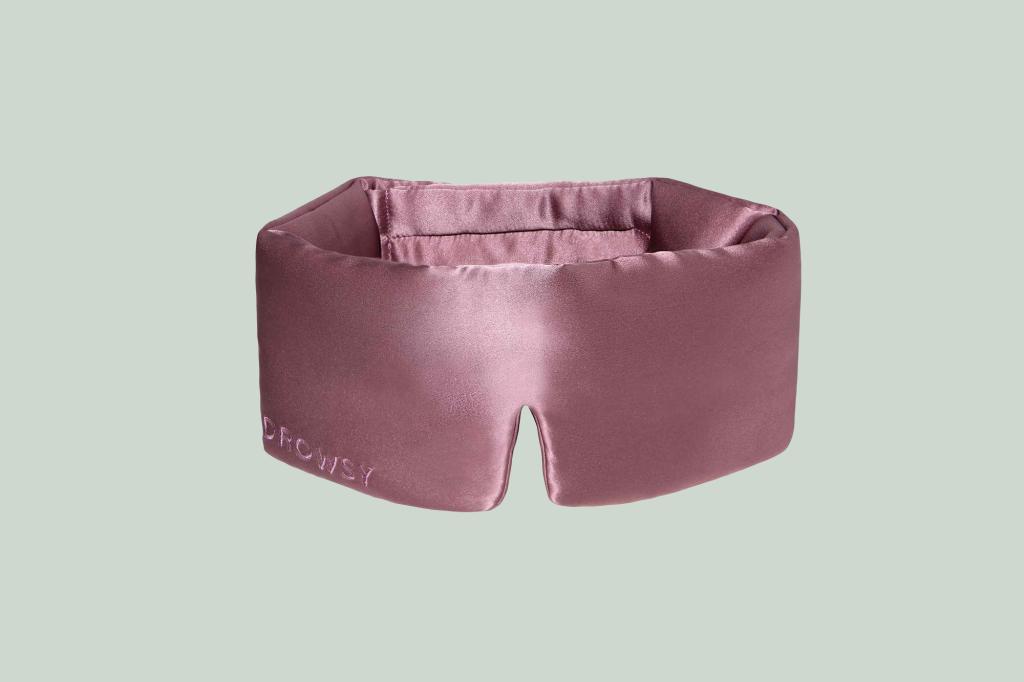 Jessica Alba wearing a pink sleeping mask