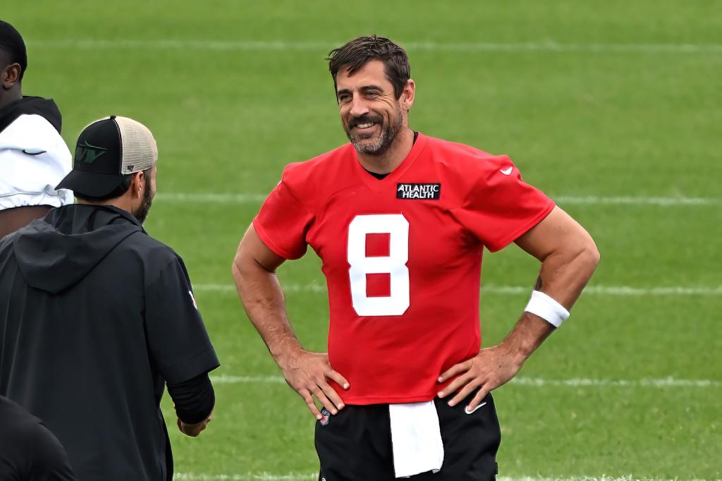 ets quartertback Aaron Rodgers smiles during OTAs in Florham Park, NJ.