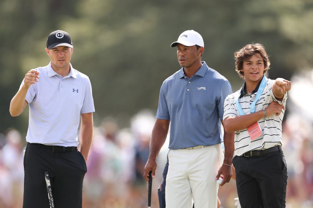 Jordan Spieth (l.) with Tiger Woods (c.) and Charlie Woods (r.) on Monday.