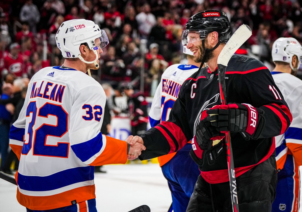 Kyle MacLean and Jordan Staal shake hands after the first round.