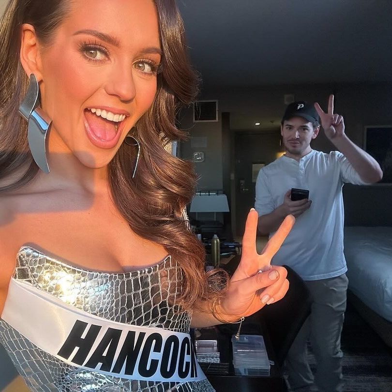 Bill Belichick in the background with his new girlfriend, Jordon Hudson, a 24-year-old former competitive cheerleader, in a silver dress