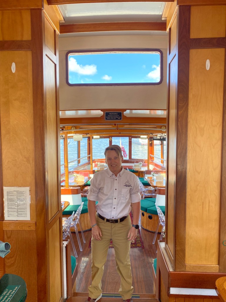 A man standing in the doorway of a boat, identified as Capt. Cait Field, dated June 10, 2024